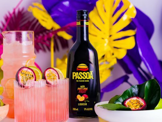 Passoã Mule cocktail with bottle of Passoã and set dressing