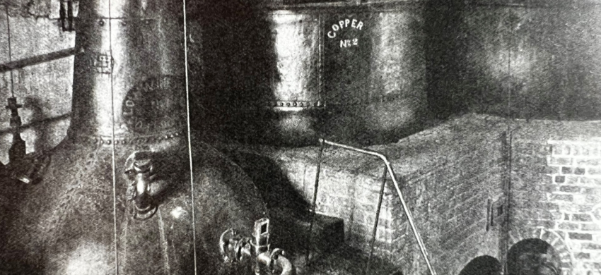 Vintage photograph showing copper stills distilling The Macallan Whisky